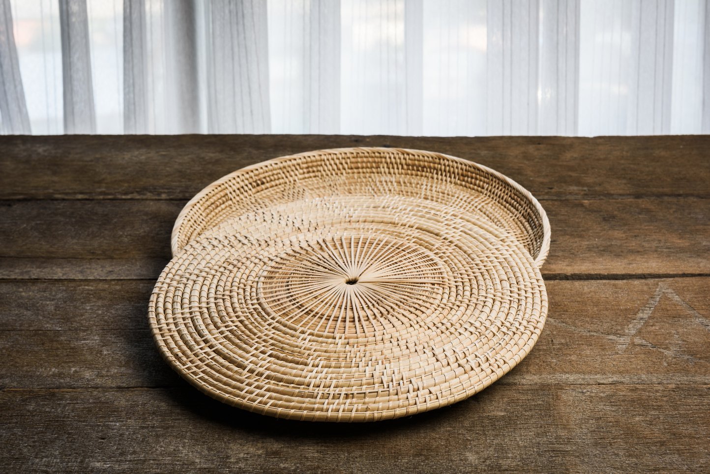 Wicker placemat on bamboo placemats